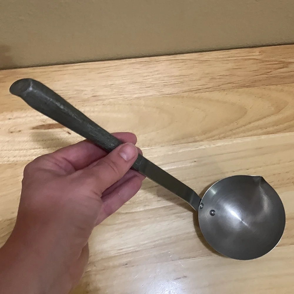 Stainless Steel vintage Ladle with cool sculpted handle